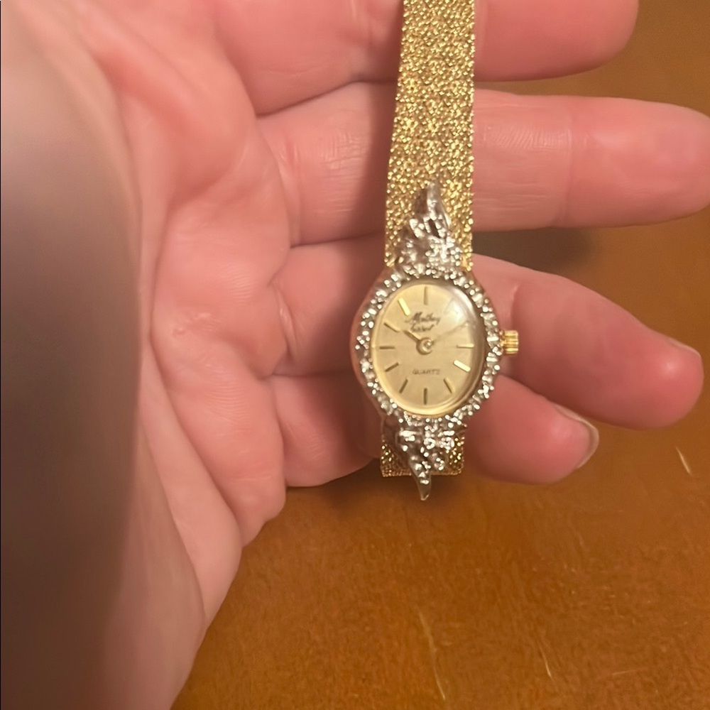 Gold and Silver Luxurious Watch with Sparkling Accents